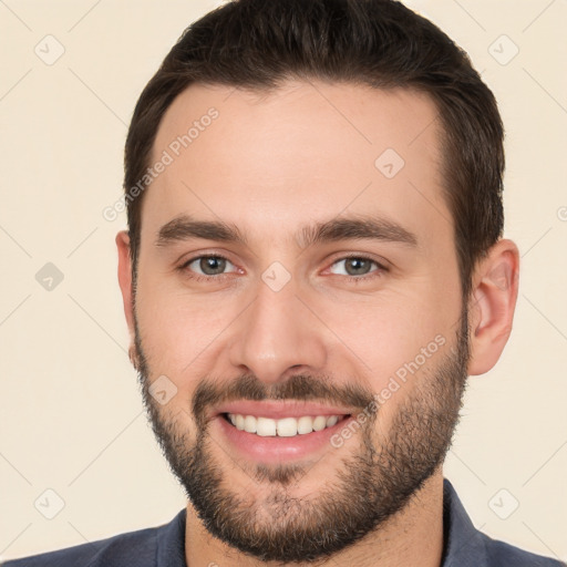 Joyful white young-adult male with short  brown hair and brown eyes