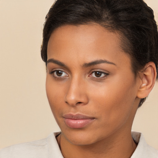 Neutral latino young-adult female with short  brown hair and brown eyes