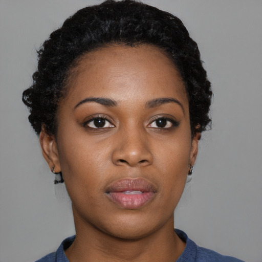 Neutral black young-adult female with short  black hair and brown eyes