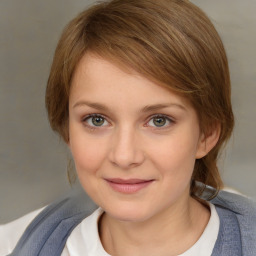 Joyful white young-adult female with medium  brown hair and blue eyes