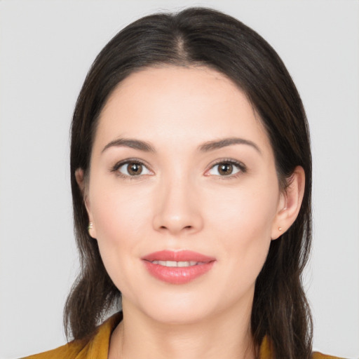 Joyful asian young-adult female with long  brown hair and brown eyes