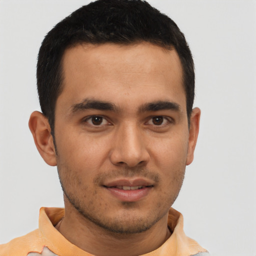 Joyful asian young-adult male with short  black hair and brown eyes