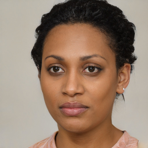 Neutral black young-adult female with medium  black hair and brown eyes