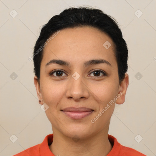 Joyful latino young-adult female with short  brown hair and brown eyes