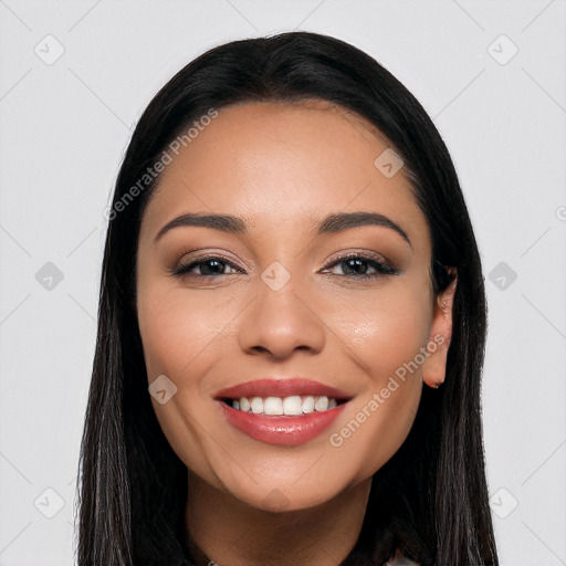 Joyful latino young-adult female with long  black hair and brown eyes