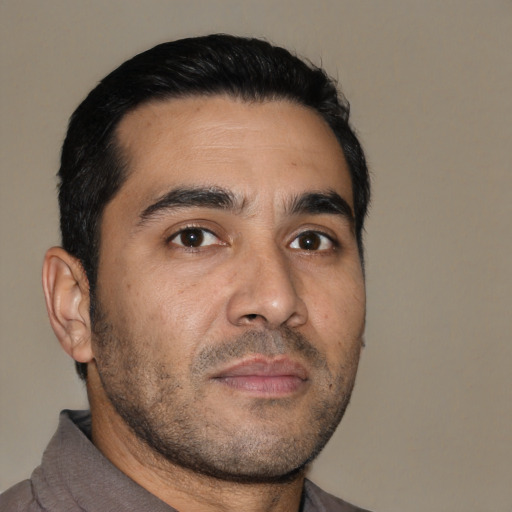 Neutral latino adult male with short  black hair and brown eyes