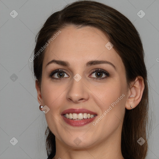 Joyful white young-adult female with long  brown hair and grey eyes