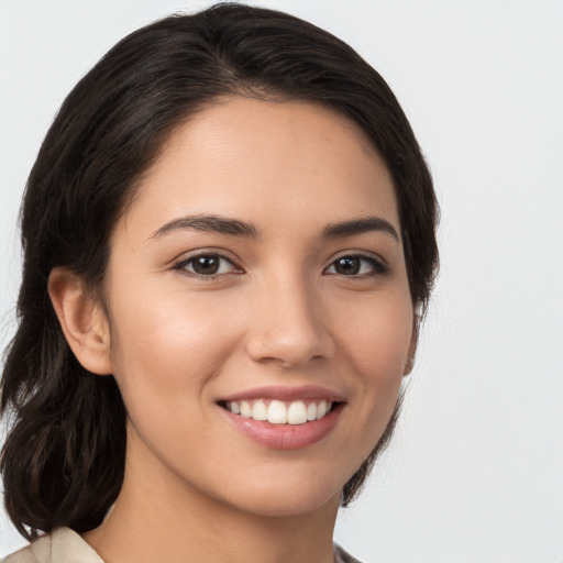 Joyful white young-adult female with medium  brown hair and brown eyes