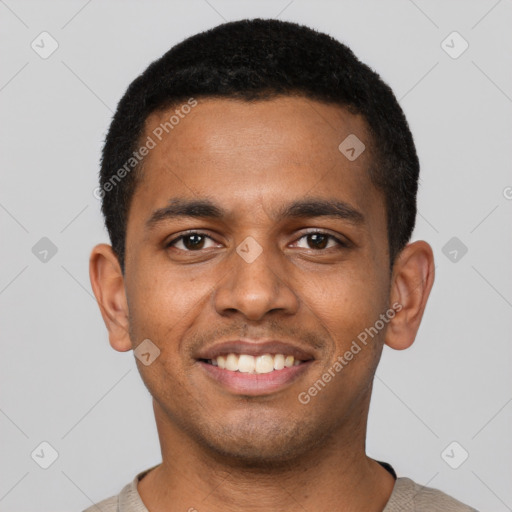 Joyful black young-adult male with short  black hair and brown eyes