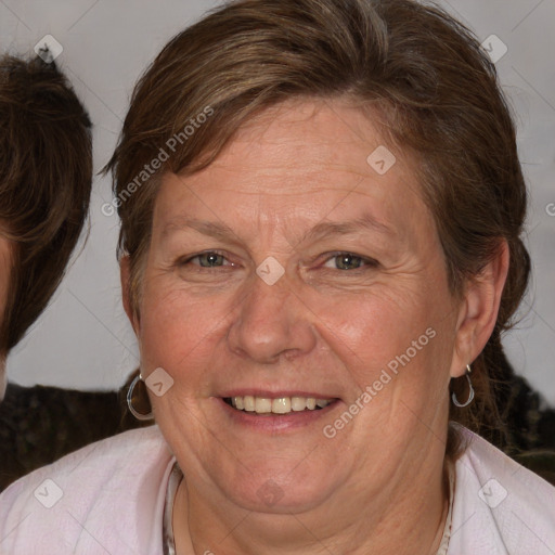 Joyful white adult female with medium  brown hair and blue eyes