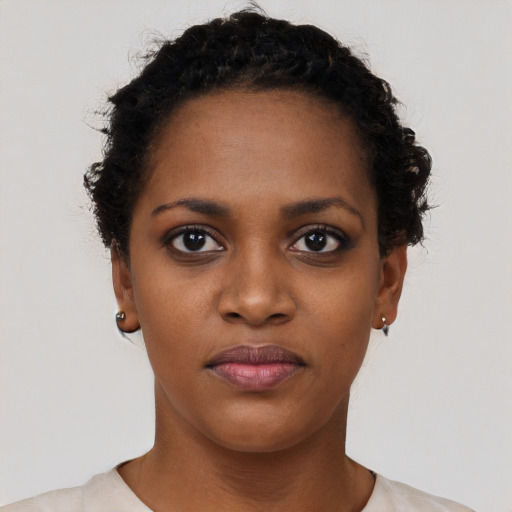 Neutral black young-adult female with short  black hair and brown eyes
