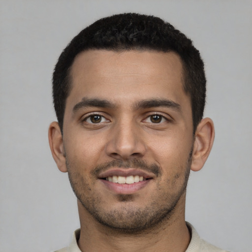 Neutral latino young-adult male with short  black hair and brown eyes