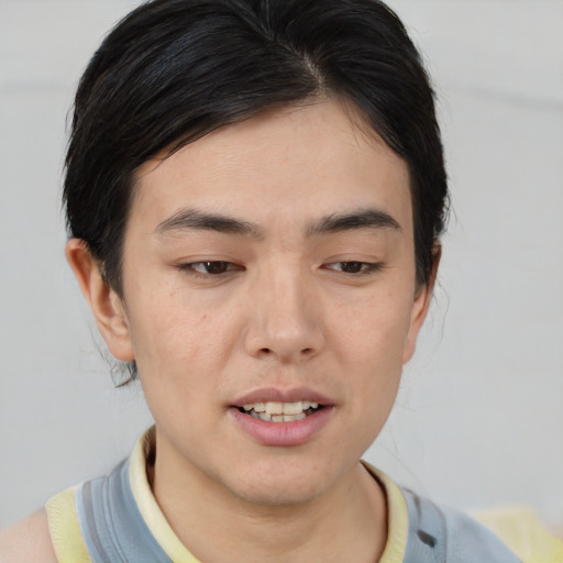 Joyful asian young-adult male with medium  brown hair and brown eyes