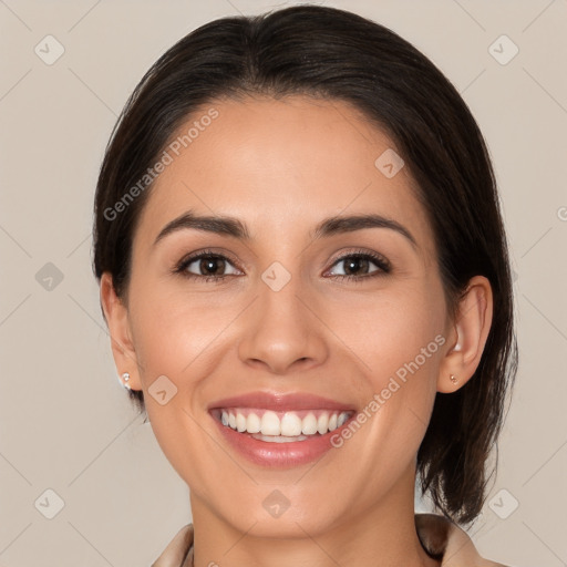 Joyful white young-adult female with medium  brown hair and brown eyes