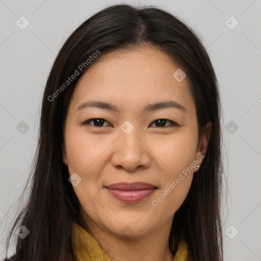 Joyful asian young-adult female with long  brown hair and brown eyes