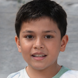 Joyful white child male with short  brown hair and brown eyes