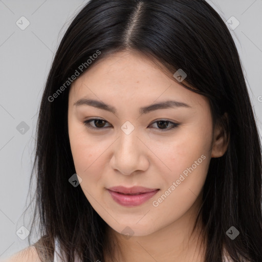 Joyful asian young-adult female with long  brown hair and brown eyes