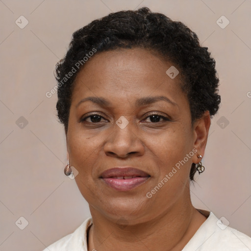 Joyful black adult female with short  brown hair and brown eyes