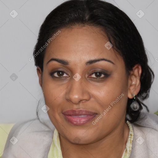 Joyful latino adult female with medium  brown hair and brown eyes