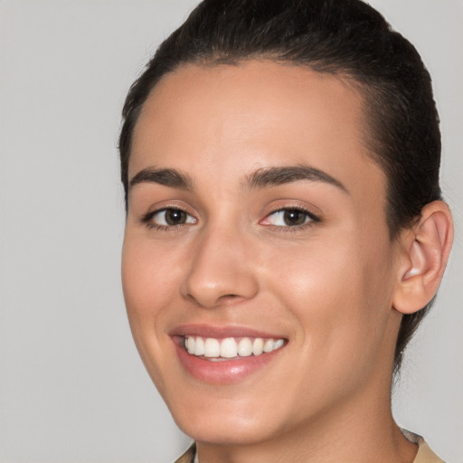 Joyful white young-adult female with medium  brown hair and brown eyes