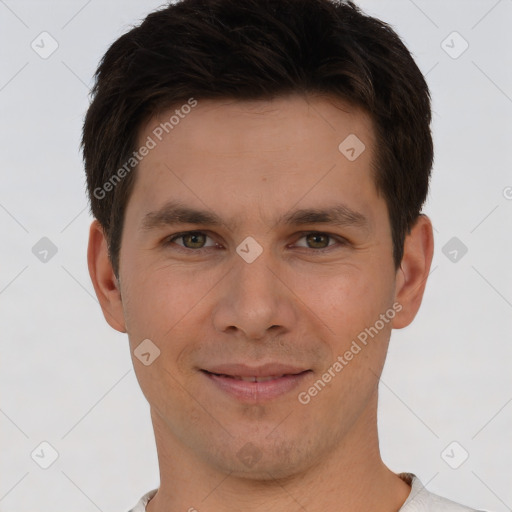 Joyful white young-adult male with short  brown hair and brown eyes