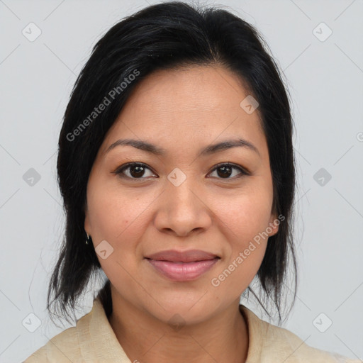 Joyful latino young-adult female with medium  brown hair and brown eyes