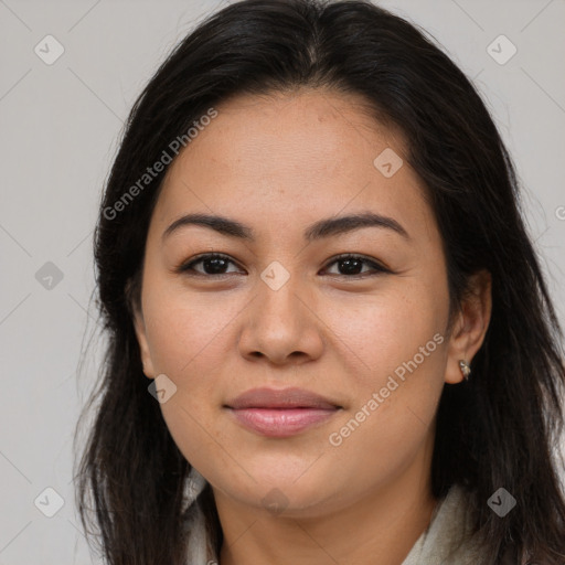 Joyful latino young-adult female with long  brown hair and brown eyes