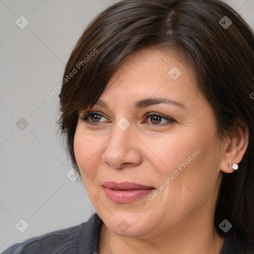 Joyful white adult female with medium  brown hair and brown eyes