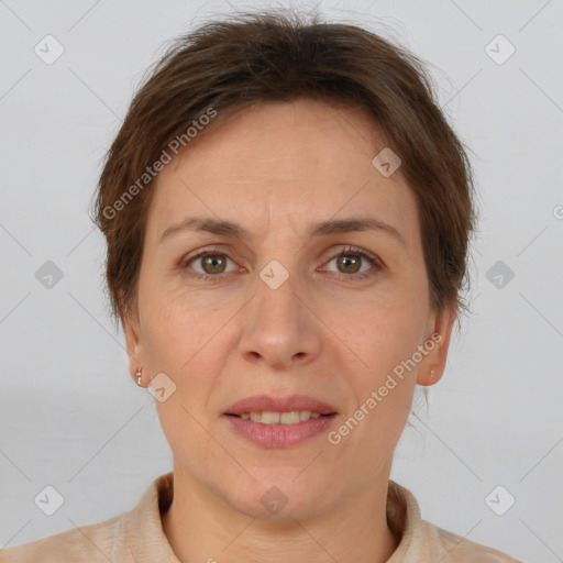 Joyful white adult female with short  brown hair and brown eyes