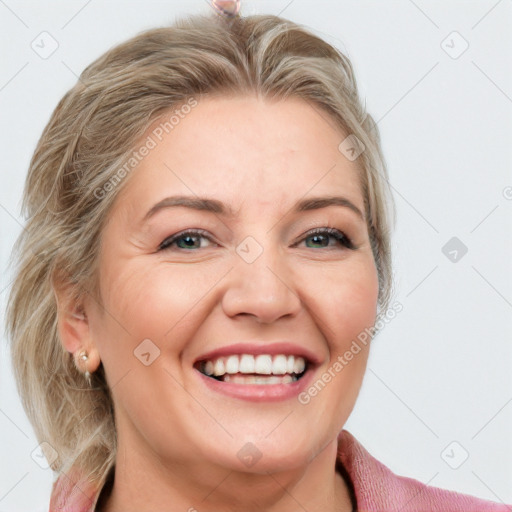 Joyful white adult female with medium  brown hair and blue eyes