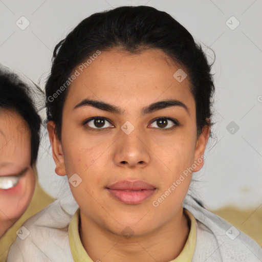 Joyful latino young-adult female with medium  brown hair and brown eyes