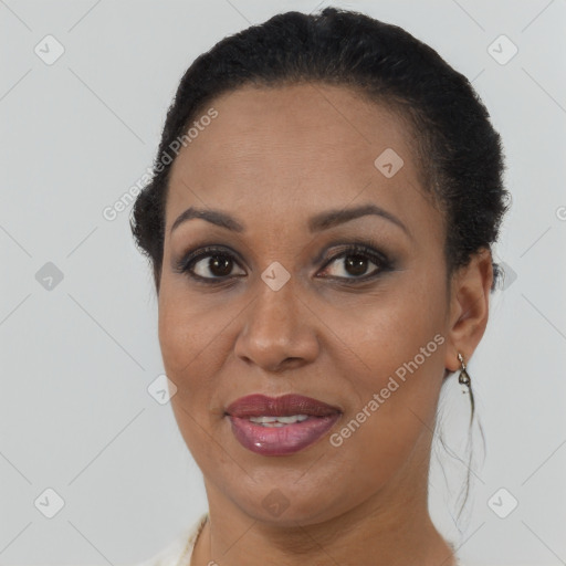 Joyful black adult female with short  brown hair and brown eyes