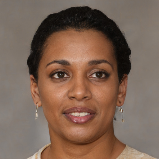 Joyful black young-adult female with short  brown hair and brown eyes