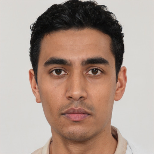 Neutral latino young-adult male with short  black hair and brown eyes