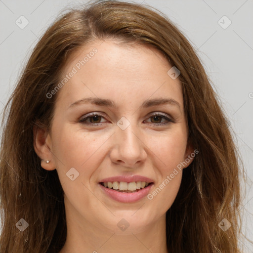 Joyful white adult female with long  brown hair and brown eyes