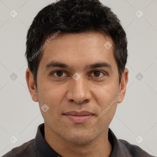 Joyful white adult male with short  black hair and brown eyes