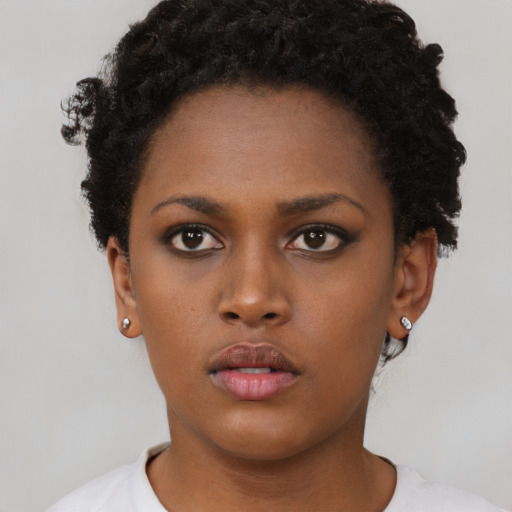Neutral black young-adult female with short  black hair and brown eyes