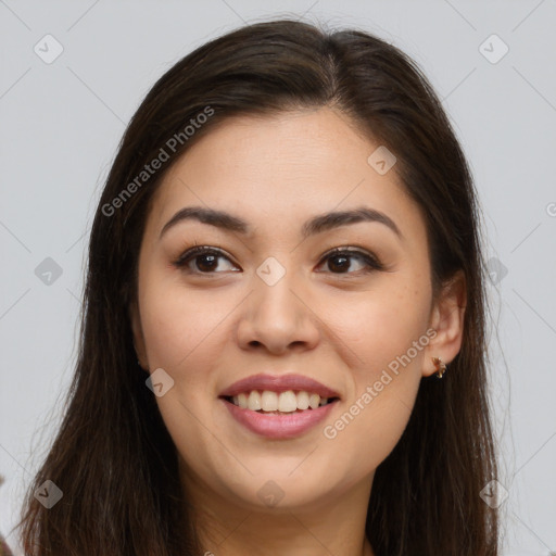 Joyful asian young-adult female with long  brown hair and brown eyes