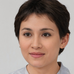 Joyful white young-adult female with medium  brown hair and brown eyes