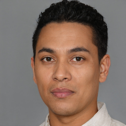 Neutral latino young-adult male with short  black hair and brown eyes