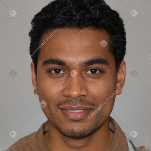 Joyful black young-adult male with short  black hair and brown eyes
