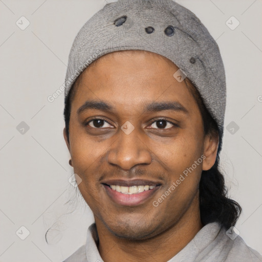 Joyful black young-adult male with short  black hair and brown eyes