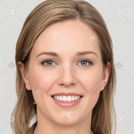 Joyful white young-adult female with long  brown hair and grey eyes