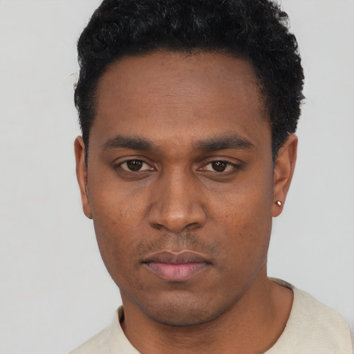 Neutral black young-adult male with short  black hair and brown eyes