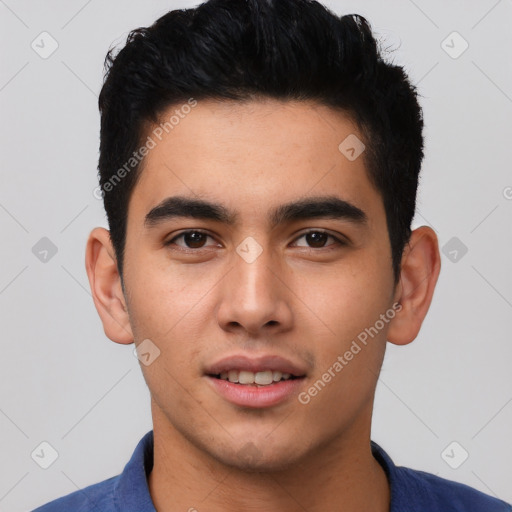 Joyful latino young-adult male with short  black hair and brown eyes