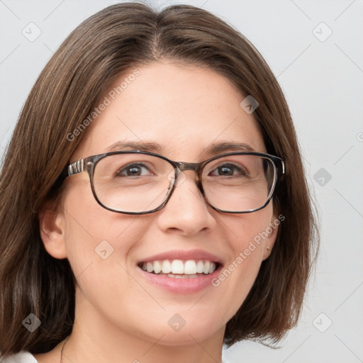 Joyful white adult female with medium  brown hair and blue eyes