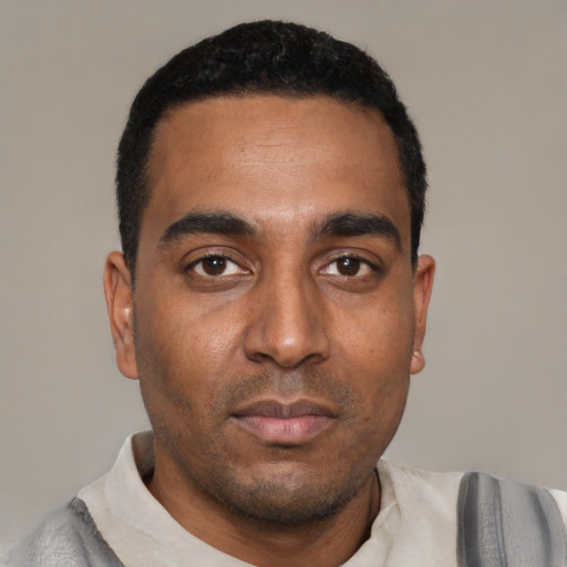 Neutral black young-adult male with short  black hair and brown eyes
