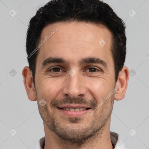 Joyful white young-adult male with short  black hair and brown eyes