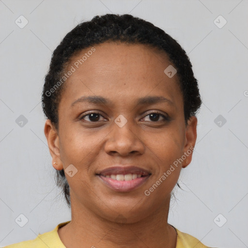 Joyful black young-adult female with short  brown hair and brown eyes