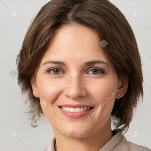 Joyful white young-adult female with medium  brown hair and grey eyes